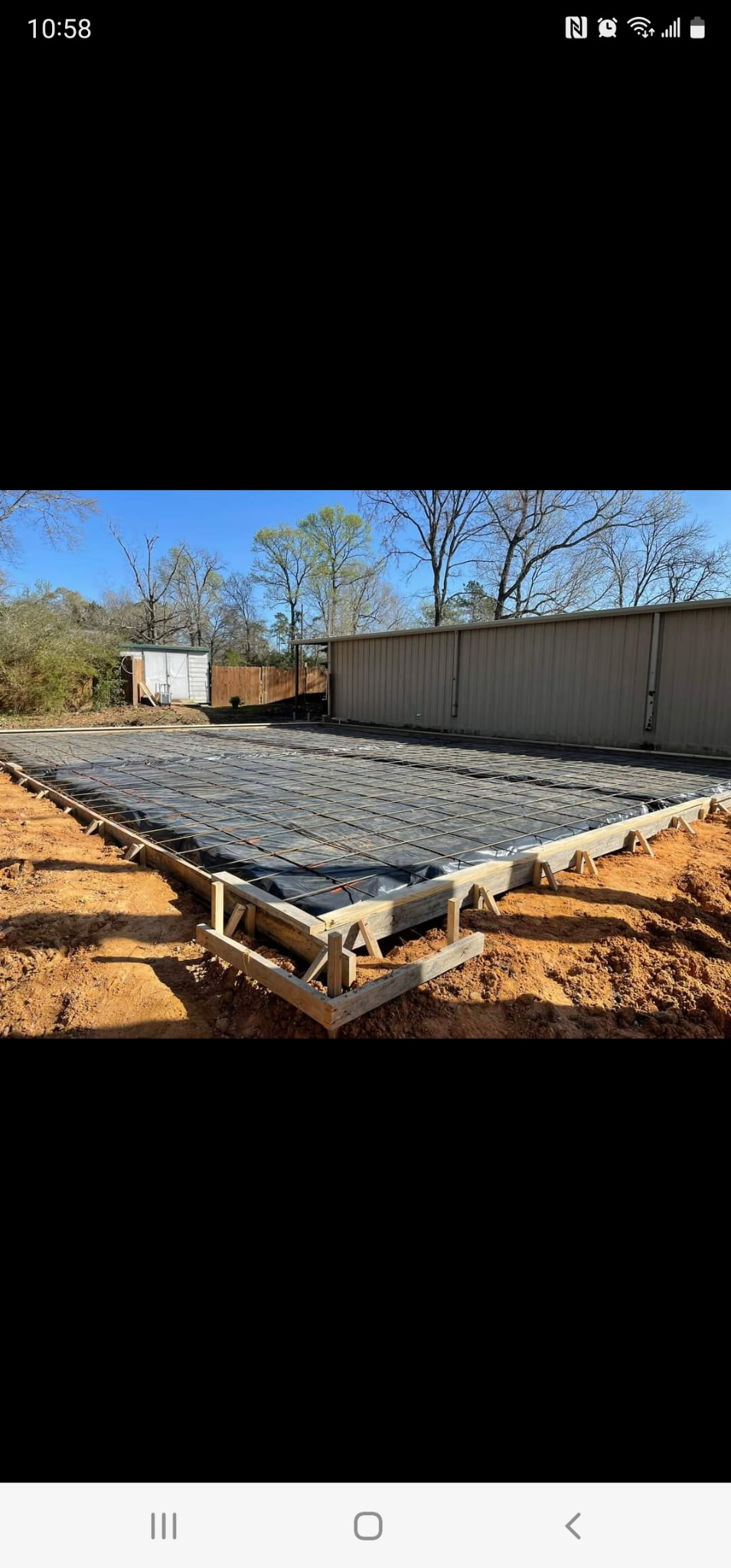 Fresh concrete driveway being finished