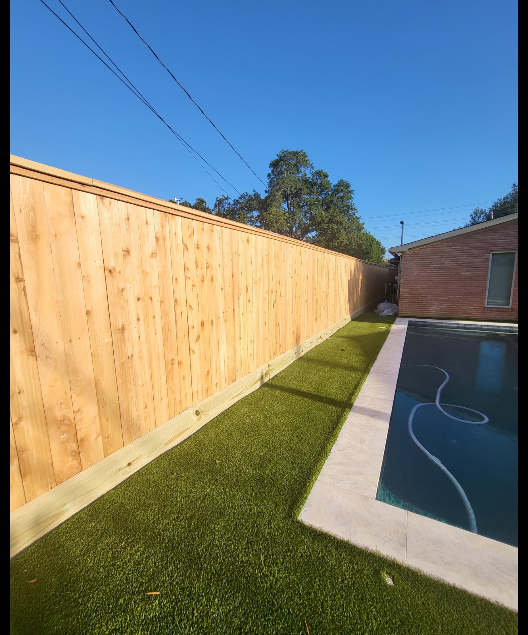 Fresh cedar privacy fence around pool